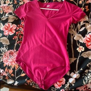 A fitted body suit with short sleeves